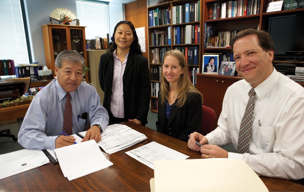 The Elder Abuse Justice Unit reviewing cases. (left to right) Keith Kaneshiro, Dawnie Ichimura, Kimberly Korte, and Lead Attorney Scott Spallina.