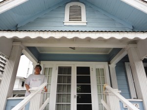 Osajima at the front porch of Project Dana office and doing an orientation inside with volunteer Ashley.
