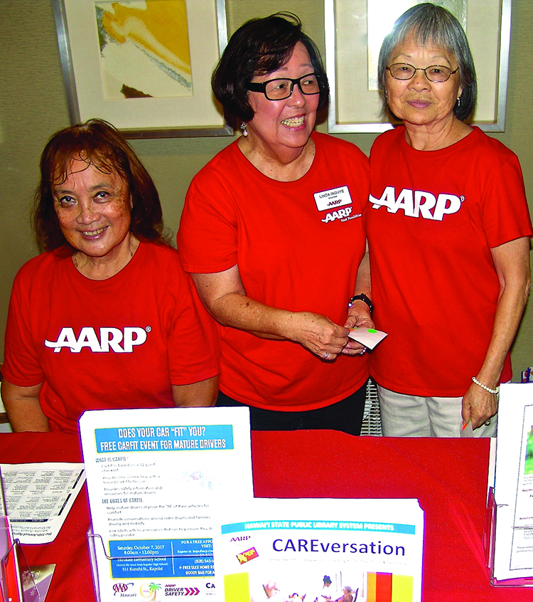 The AARP table had more than a dozen volunteers throughout the day: (L–R) Pat Frank, Linda Inouye and Nancy Hironaka.