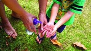 After playing, help grandchildren wash their hands with soap and clean water.