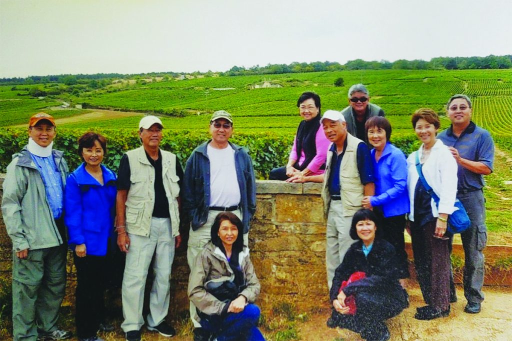 World Class Vineyards in Bourgogne, France.  Kneeling: Annette Pang and Kathleen Ching, Middle: Ronald & Penny Mau, Russell Ching, Wendell Pang, Steve & Tina Chung, Cynthia & Guy Seu, Back: Loretta & Tyler Yajima