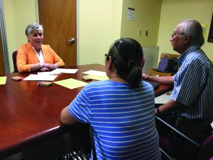Photo of Lori Protzman, RN, coordinator for the Queen’s Advance Care Planning Clinic, meets with adults and families to discuss healthcare planning, quality-of-life values and choices, and related documentation to ensure wishes are followed.