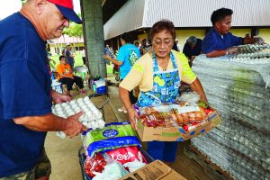 PHOTOGRAPHS OF HAWAII FOODBANK'S DONATIONS TO DYNAMIC COMPASSIONS IN ACTION/OHANA PRODUCE PLUS AND DCIA/OPP FOOD DISTRIBUTION PROGRAM AT THE WAIMANALO DISTRICT PARK.