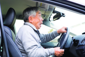 Photo of senior driver having issues