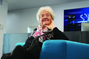 A senior lady sits waiting in the reception area of a robotics company in Cambridge, a city renowned for being one of the top three technology hubs in the world.
