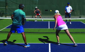photo of Pickleball - Mixed Doubles Action of Colorful Court